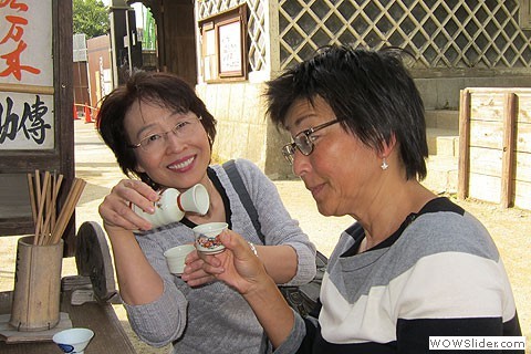 two women drink sake