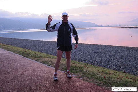 Runner waves to the camera